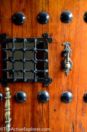 Heavy wood door leading to La Quinta Luna 