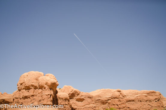 Contrail over Arches National Park