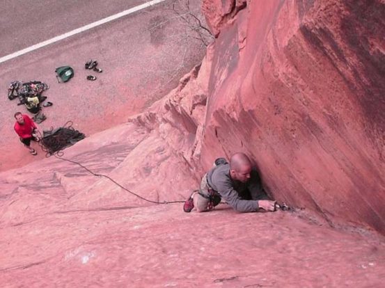 Climbing with a friend in Moab